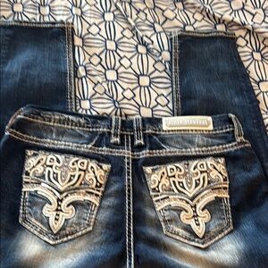 Rock Revival Blue Boot Cut Jeans with Ornate Stitching